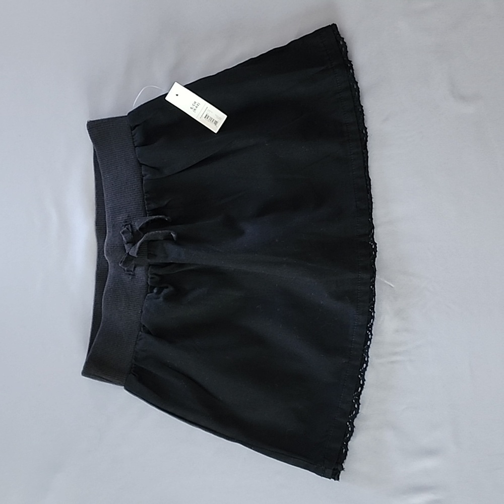 Faded Glory girls black skort. With lace botton trim. Size S/CH